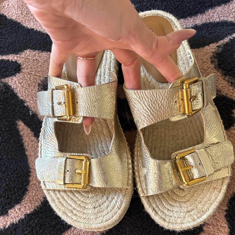 See by Chloé Glyn Dual-Buckle Espadrille Sandals in gold leather.